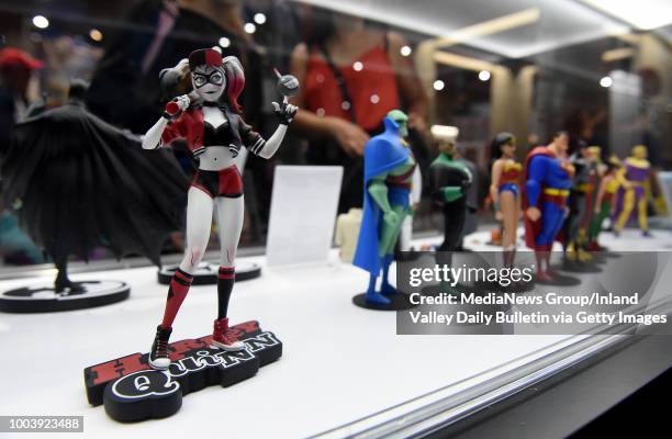 Figurines for sale at the DC Comics booth during Preview Night during the San Diego Comic-Con at the San Diego Convention Center in San Diego on...