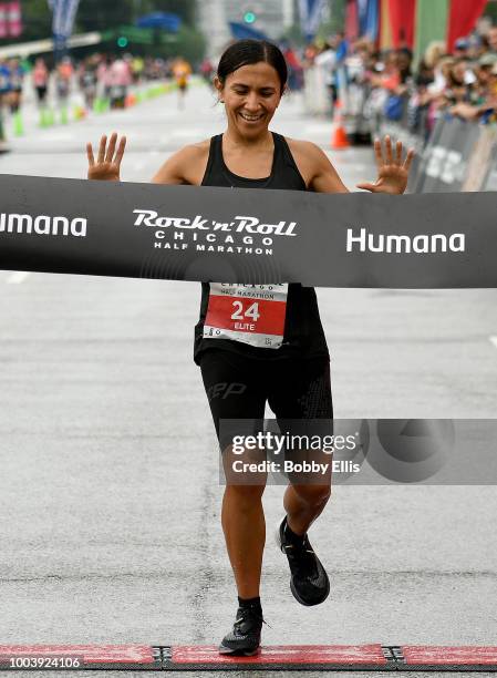 Diana Bogantes Gonzales, the first place female racer, crosses the finish line of the Rock "n" Roll Chicago Half Marathon on July 22, 2018 in...