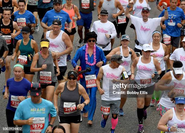 Runners of the Rock "n" Roll Chicago Half Marathon and 10K leave the starting line on July 22, 2018 in Chicago, Illinois.