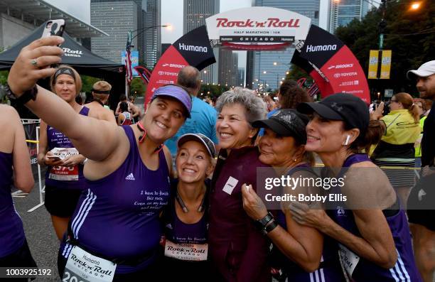 Runners take a selfie before the start of the Rock "n" Roll Chicago Half Marathon and 10K on July 22, 2018 in Chicago, Illinois.
