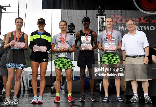 The top male and female finishers of the Rock "n" Roll Chicago 10K pose for a photo during an awards ceremony on July 22, 2018 in Chicago, Illinois.