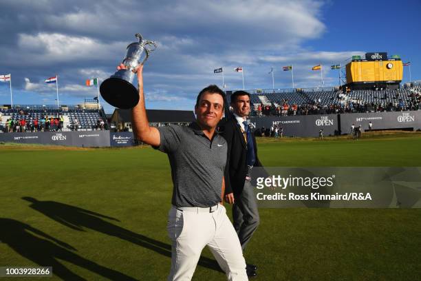 Francesco Molinari of Italy holds the Claret Jug as Champion Golfer after winning the 147th Open Championship at Carnoustie Golf Club on July 22,...