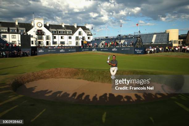Francesco Molinari of Italy celebrates with the Claret Jug after winning the 147th Open Championship at Carnoustie Golf Club on July 22, 2018 in...