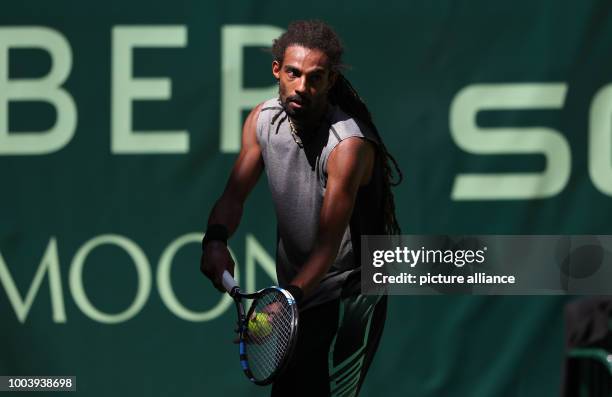 German tennis player Dustin Brown in action during the ATP tennis tournament match against his Canadian opponent Vasek Pospisil in Halle, Germany, 19...