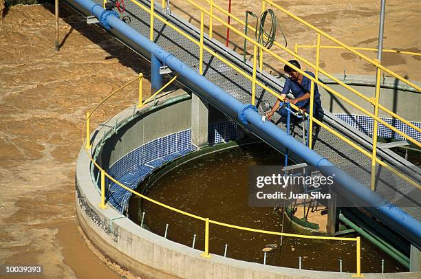 worker in water treatment plant - water treatment stock-fotos und bilder