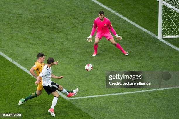 Germany's Leon Goretzka beats Australian keeper Maty Ryan and defender Milos Degenek to give his side a 3:1 lead during the Confederations Cup group...