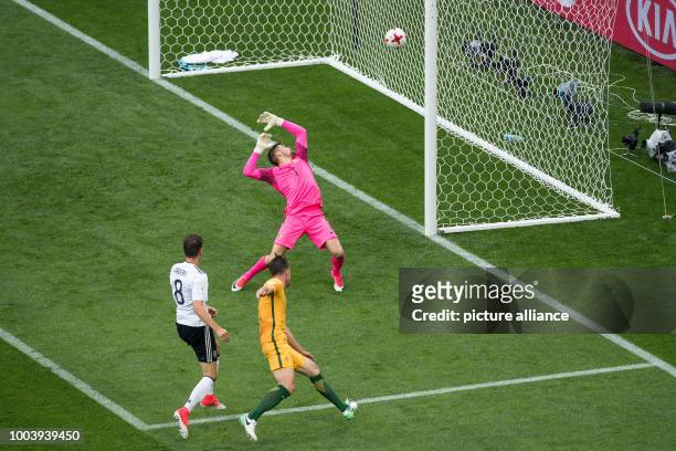 Germany's Leon Goretzka beats Australian keeper Maty Ryan and defender Milos Degenek to give his side a 3:1 lead during the Confederations Cup group...