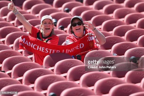 Manchester United fans pose ahead of the pre-season friendly match between Manchester United and San Jose Earthquakes at Levi's Stadium on July 22,...