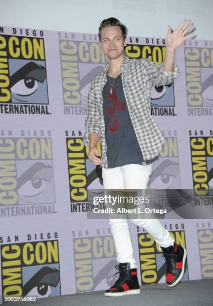 Alexander Calvert walks onstage at the "Supernatural" special video presentation and Q&A during Comic-Con International 2018 at San Diego Convention...