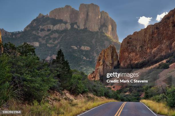 on the road in the mountains of big bend national park - chisos mountains stock pictures, royalty-free photos & images