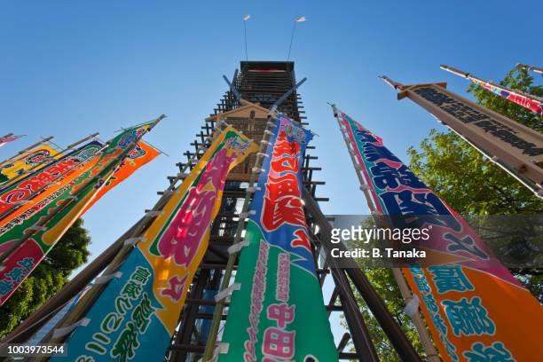 colorful banners and traditional drum tower at ryogoku sumo hall in the sumida ward of tokyo, japan - wrestling arena stock pictures, royalty-free photos & images