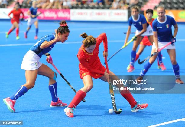 Yang Chen of China is challenged by Jasbeer Singh of Italy during the Pool A game between China and Italy of the FIH Womens Hockey World Cup at Lee...