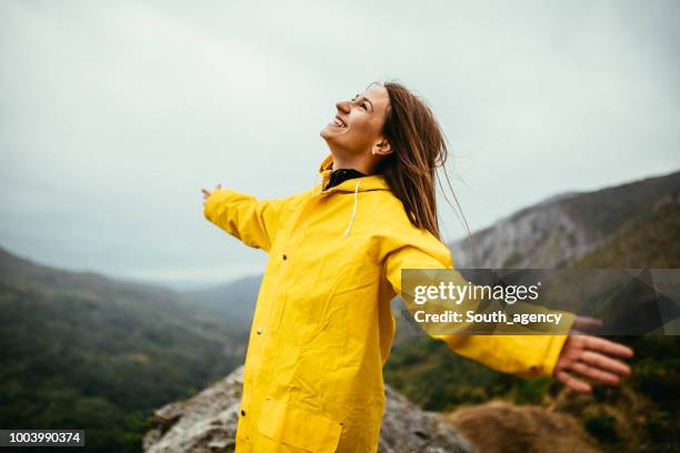 woman loves the rain - rainy season stock pictures, royalty-free photos & images