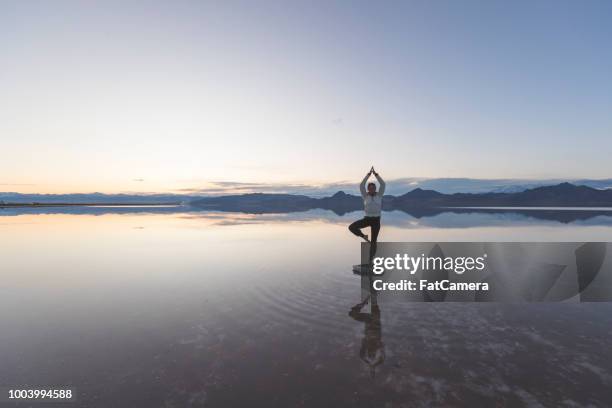 young woman exercising in the utah salt flats - self improvement stock pictures, royalty-free photos & images