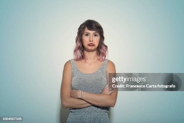 mimic and facial expressions - frowning stock pictures, royalty-free photos & images