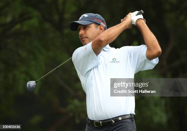 Jeev Milkha Singh of India watches a shot during the Open Championship International Final Qualifying America at the Gleneagles Country Club on May...