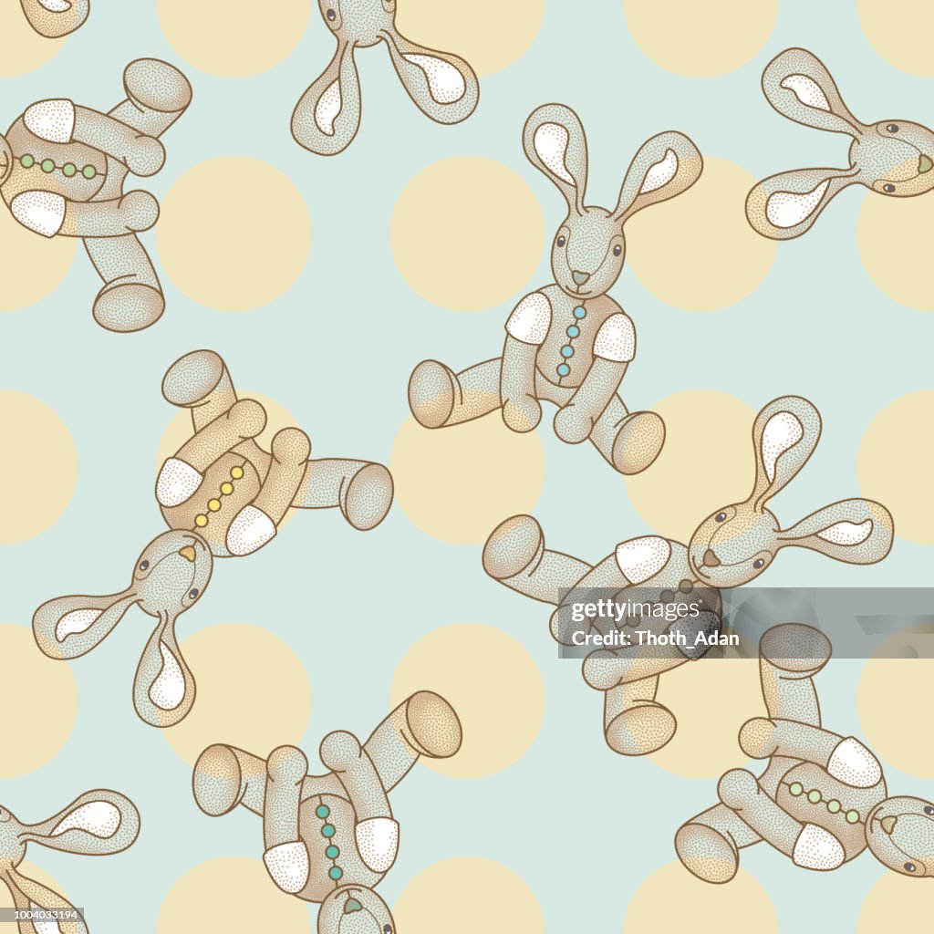Seamless pattern with rabbits and yellow polka dots on light blue background