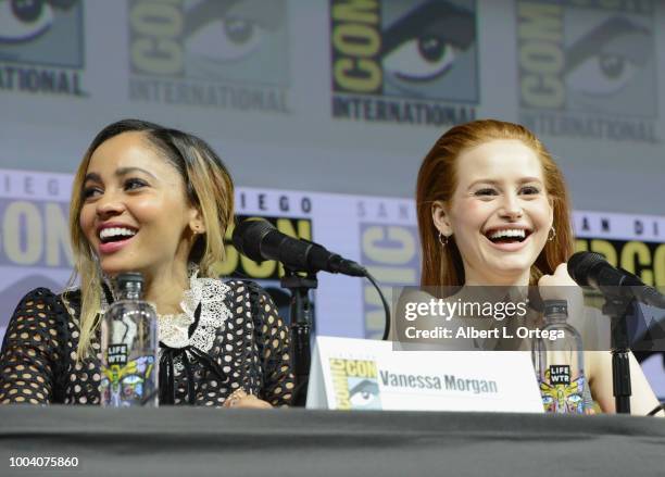 Vanessa Morgan and Madelaine Petsch speak onstage at the "Riverdale" special video presentation and Q&A during Comic-Con International 2018 at San...
