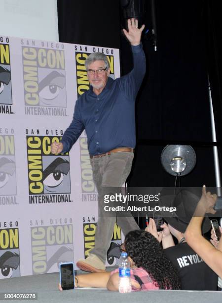 Robert Singer walks onstage at the "Supernatural" special video presentation and Q&A during Comic-Con International 2018 at San Diego Convention...
