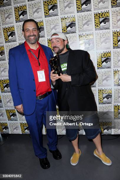 Comic-Con International Director of Programming Eddie Ibrahim and Kevin Smith, recipient of an Inkpot Award, pose at 'An Evening with Kevin Smith'...
