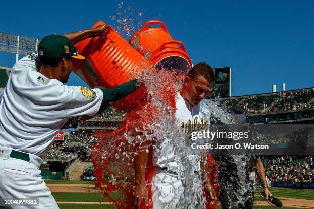 Matt Chapman of the Oakland Athletics has Gatorade poured on him after hitting a walk off RBI single after the game against the San Francisco Giants...