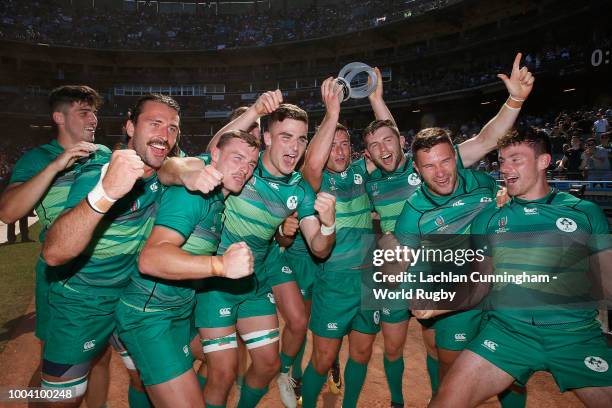 Team Ireland pose with the trophy after defeating Australia in the Challenge final on day three of the Rugby World Cup Sevens at AT&T Park on July...