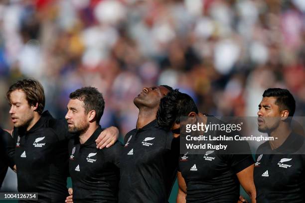 New Zealand players stand for the national anthem before their Championship final match against England on day three of the Rugby World Cup Sevens at...