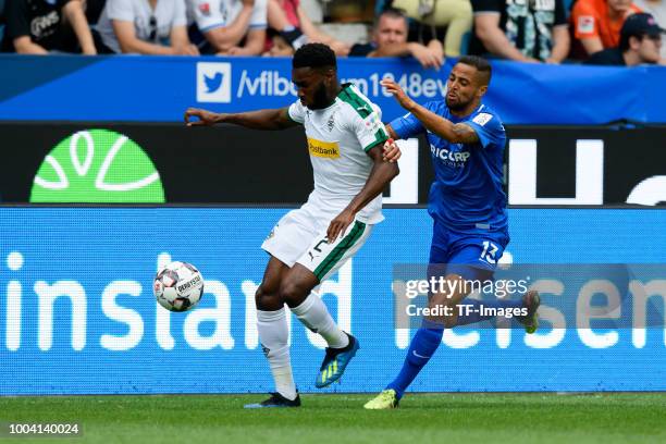 Mandela Egbo of Borussia Moenchengladbach and Sidney Sam of VfL Bochum battle for the ball during the H-Hotels Cup match between VfL Bochum and...