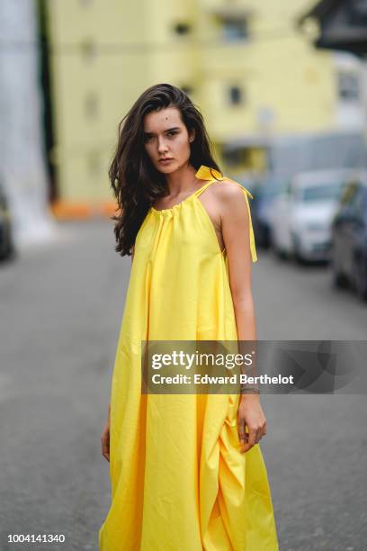 Model wears a yellow dress , during Feeric Fashion Week 2018, on July 22, 2018 in Sibiu, Romania.