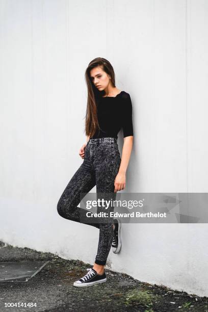 Model wears a black top, gray pants, sneakers , during Feeric Fashion Week 2018, on July 22, 2018 in Sibiu, Romania.