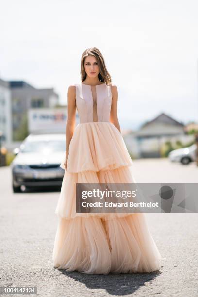 Landiana Cerciu, Vice President of Feeric Fashion Week, wears a pink lace ruffled dress , during Feeric Fashion Week 2018, on July 22, 2018 in Sibiu,...