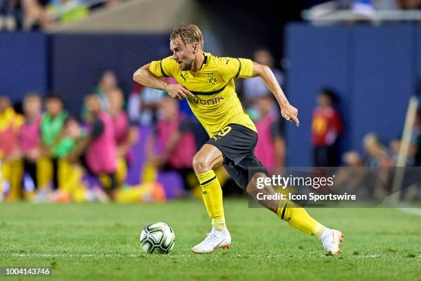 Borussia Dortmund defender Marcel Schmelzer dribbles the ball during an International Champions Cup match between Manchester City and Borussia...