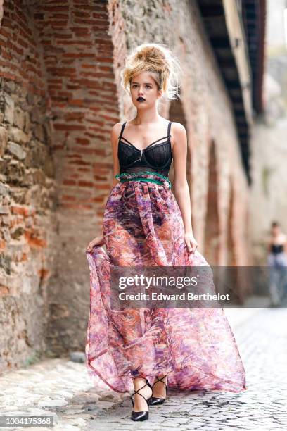 Model walks the runway during the Mondovi show, at Strada Cetatii, during Feeric Fashion Week 2018, on July 21, 2018 in Sibiu, Romania.