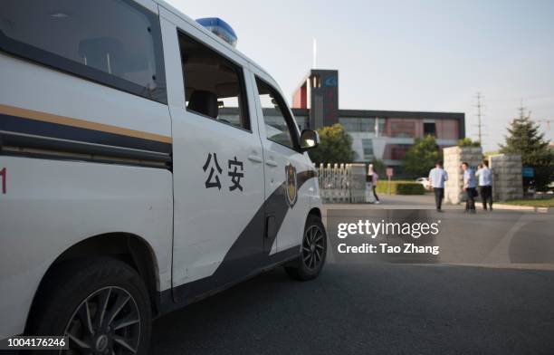 Policeman car stands outside of Changchun Changsheng Bio-tech Co, on July 23, 2018 in Changchun, China.The company was found fabricating production...