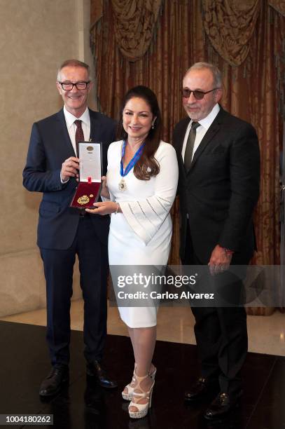 Singer Gloria Estefan , accompanied by her husband Emilio Estefan , receives the Golden Medal to the Merit in Fine Arts from Spanish Minister of...