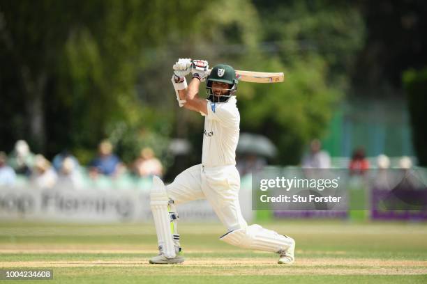 Worcestershire batsman Moeen Ali cover drives to the boundary during Day two of the Specsavers County Championship: Division One match between...