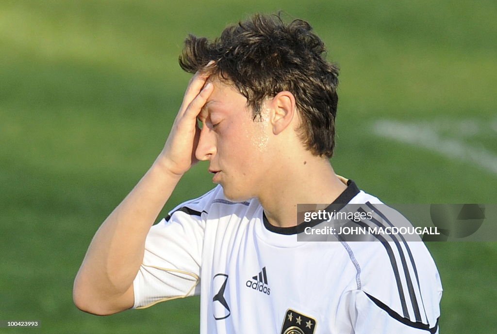 Germany's midfielder Mesut Oezil reacts