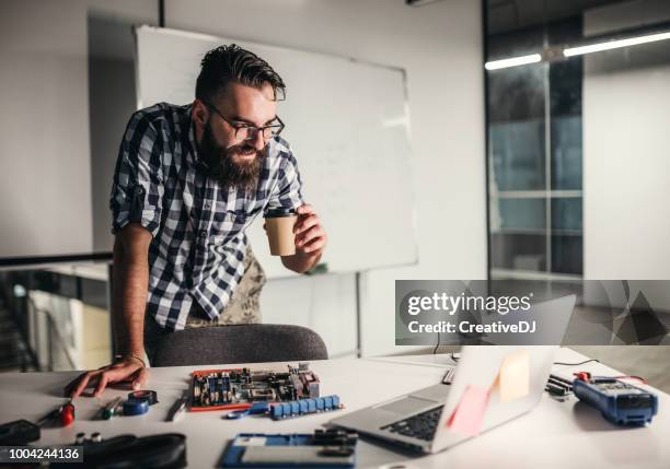 Guy Using Multimeter Desktop Multimeter Photos and Premium High Res Pictures - Getty Images