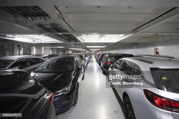 New Adam Opel AG Insignia automobiles sit parked in the cargo hold of roll-on roll-off vessel Delphine, operated by Cldn Ro-Ro SA, for shipping to...