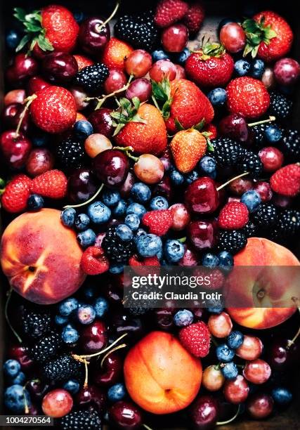 fresh fruits (carry, berries, peaches) - fruta baya fotografías e imágenes de stock