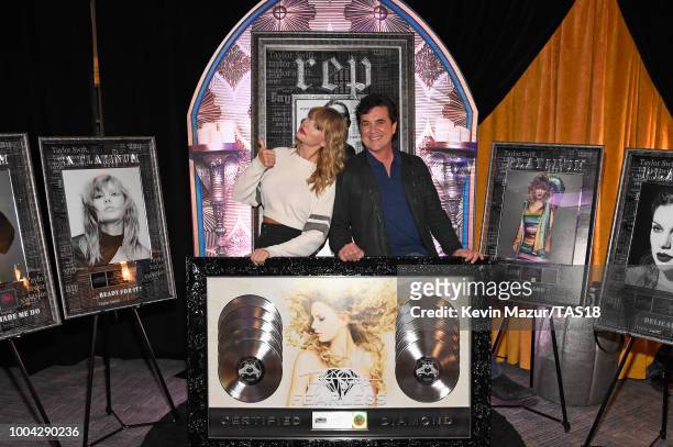Taylor Swift and CEO of Big Machine Records Scott Borchetta plaque presentation backstage at the Taylor Swift reputation Stadium Tour at MetLife...