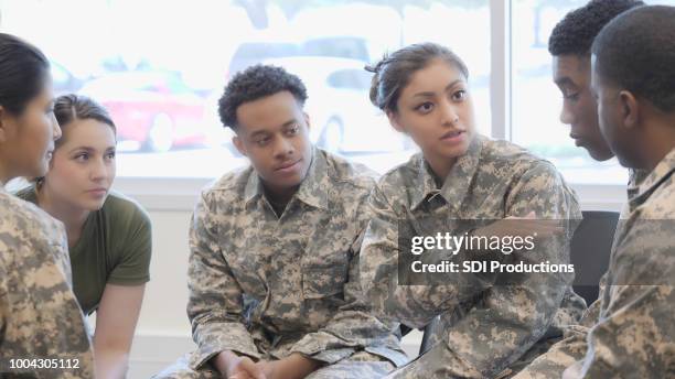 female military cadet speaks to a group in training class - cadet stock pictures, royalty-free photos & images