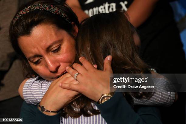 Sandra Chica, wife of Pablo Villavicencio, hugs her daughter Luciana during an advocacy rally and press conference in support of Pablo Villavicencio,...