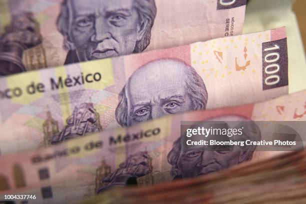mexican one thousand pesos bills are run through a counting machine - currency counting machine stock pictures, royalty-free photos & images