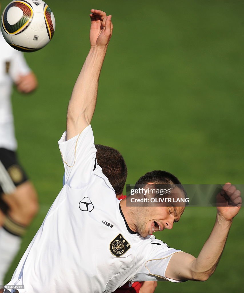 Germany's defender Heiko Westermann is p