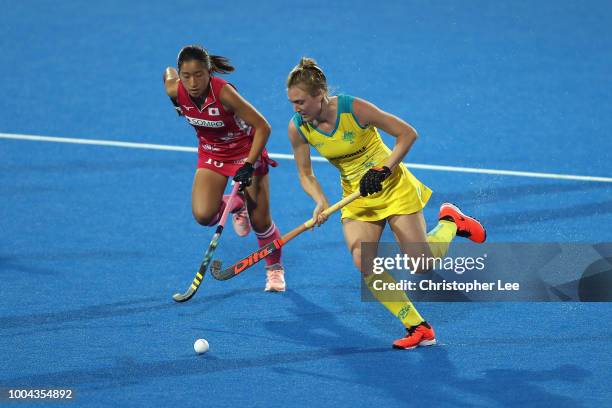 Emily Hurtz of Australia battles with Miki Kozuka of Japan during the Pool D game between Australia and Japan of the FIH Womens Hockey World Cup at...