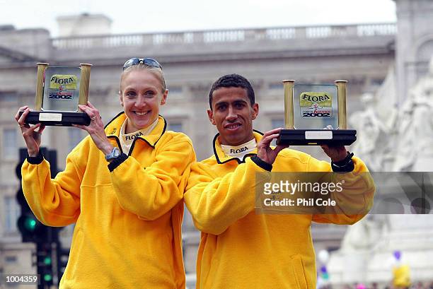 Paula Radcliffe of England and Khalid Khannouchi of USA celebrates after winning the Flora London Marathon Elite Mens and Womens races London....