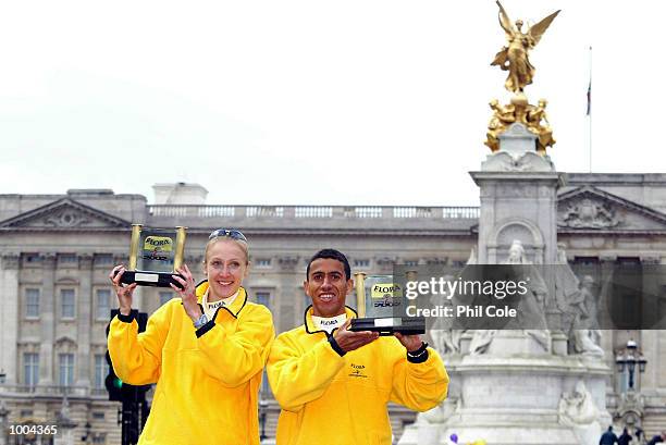 Paula Radcliffe of England and Khalid Khannouchi of USA celebrates after winning the Flora London Marathon Elite Mens and Womens races London....