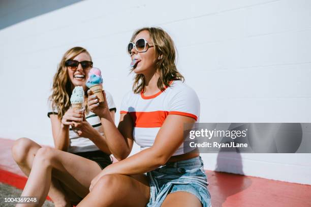 summer friends enjoy ice cream cones on hot day - ice cream imagens e fotografias de stock