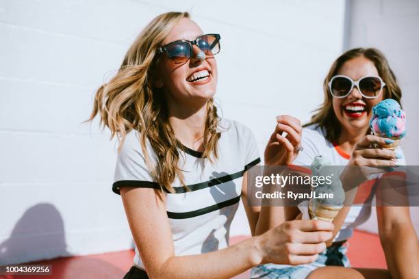summer friends enjoy ice cream cones on hot day - ice cream stock pictures, royalty-free photos & images